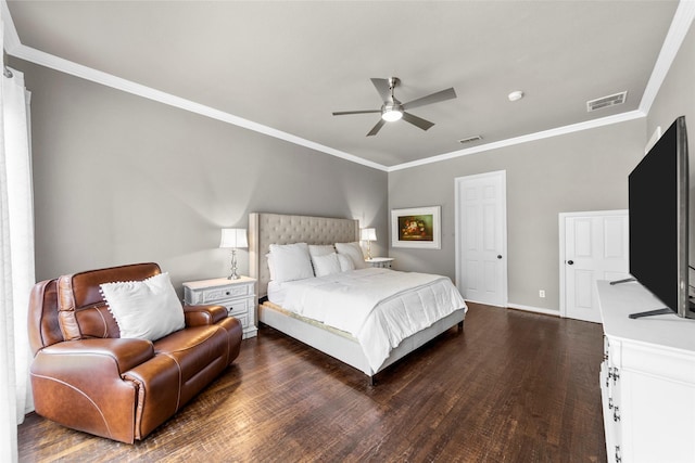 bedroom with dark wood-type flooring, ornamental molding, and ceiling fan