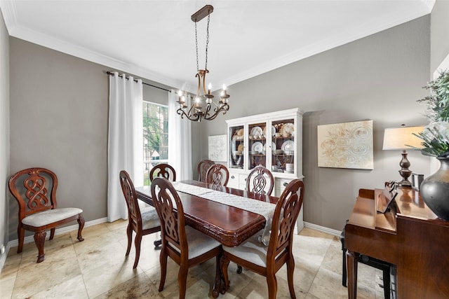 dining space featuring crown molding and a notable chandelier