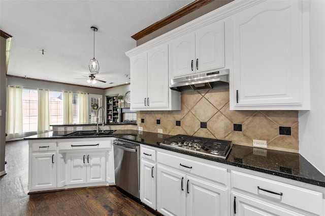 kitchen featuring white cabinetry, appliances with stainless steel finishes, kitchen peninsula, and sink