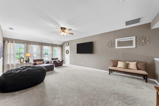 carpeted living room featuring vaulted ceiling and ceiling fan