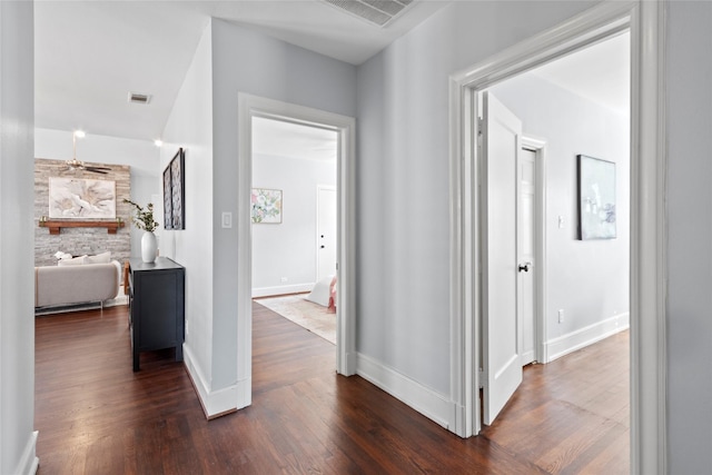 corridor featuring dark wood-type flooring