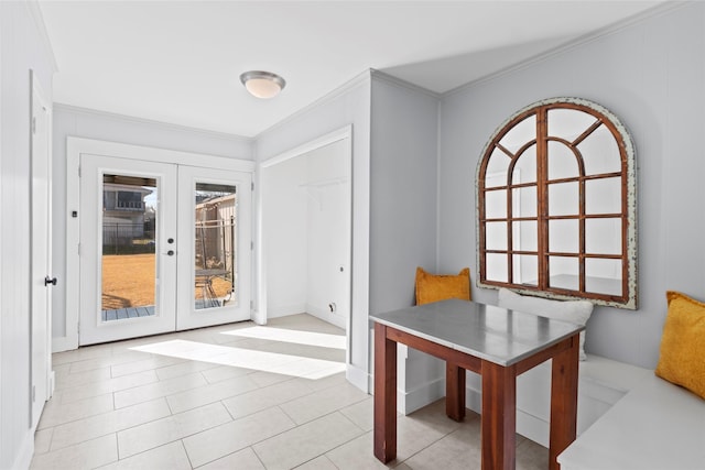 dining room featuring french doors and crown molding