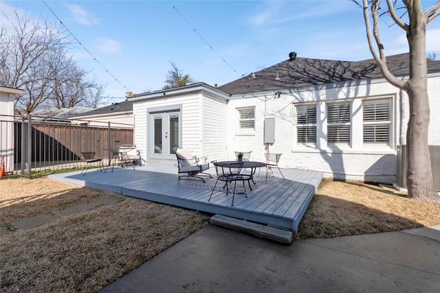 back of property with french doors and a deck