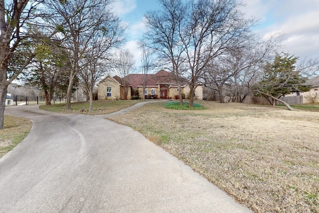 ranch-style home with a front lawn