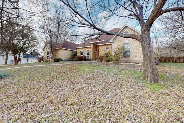 ranch-style house with a front lawn