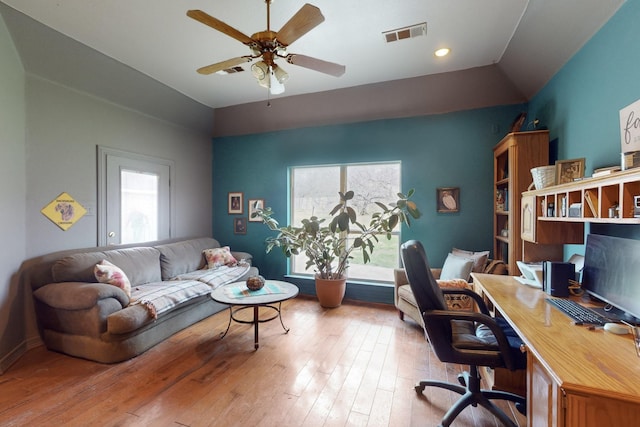 home office featuring ceiling fan, lofted ceiling, and light wood-type flooring