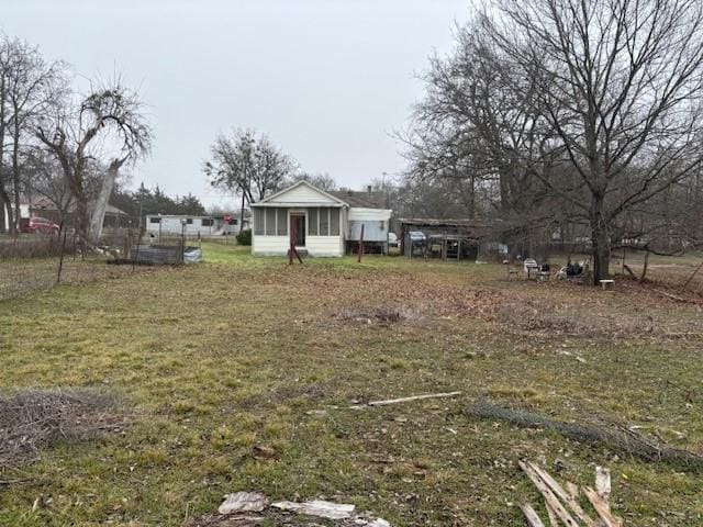 view of yard featuring a sunroom