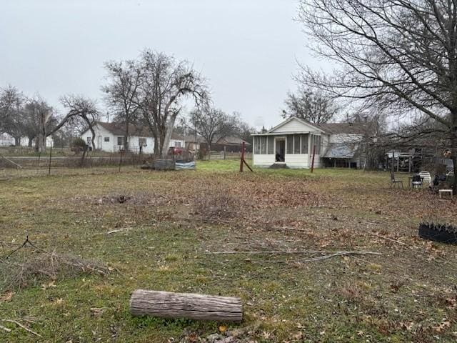 view of yard with a sunroom