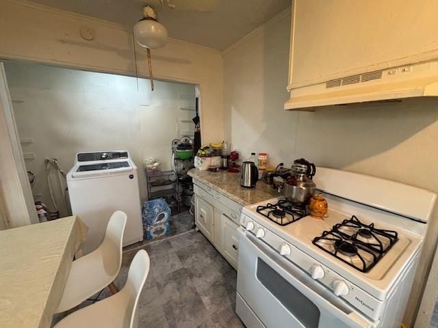 kitchen with washer / dryer, extractor fan, crown molding, white gas range, and white cabinets