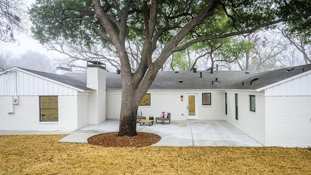 rear view of property featuring a patio