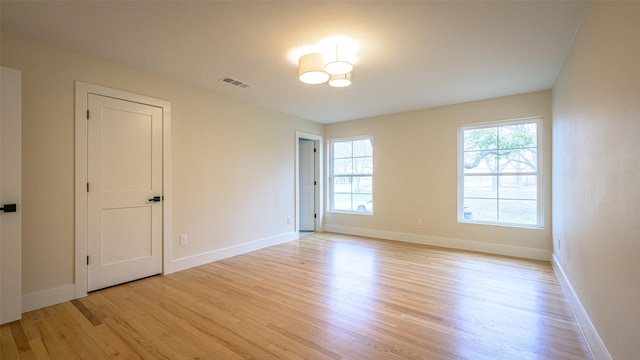 empty room with light hardwood / wood-style floors