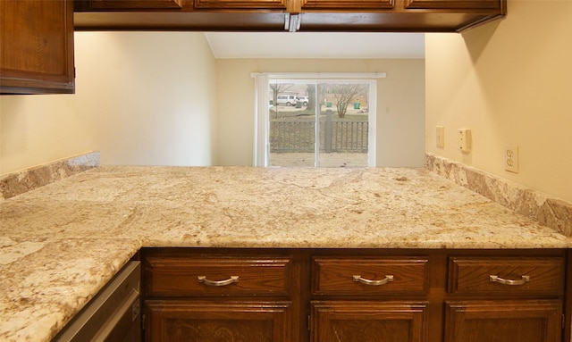 kitchen with light stone countertops