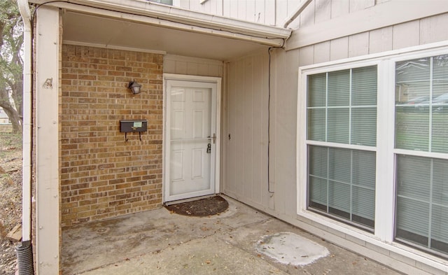 entrance to property with a patio