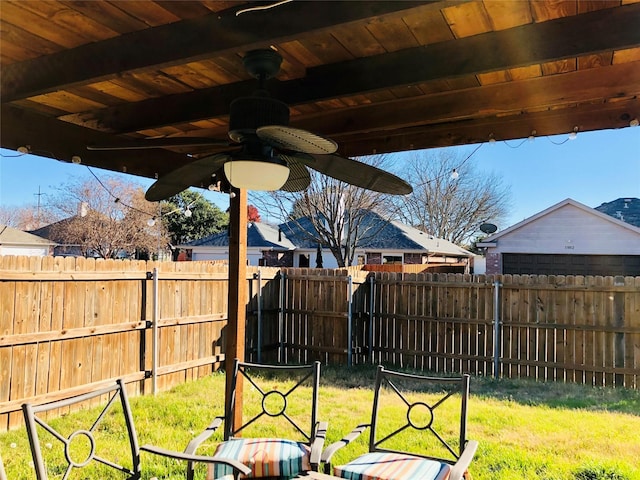 view of yard with ceiling fan