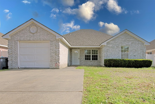 ranch-style house with a garage and a front yard