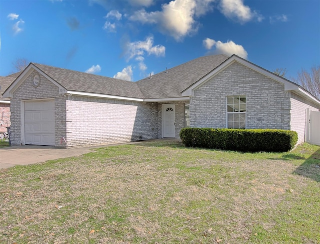 single story home featuring a garage and a front yard