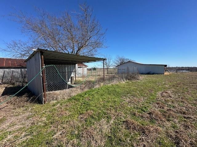 view of yard with an outdoor structure