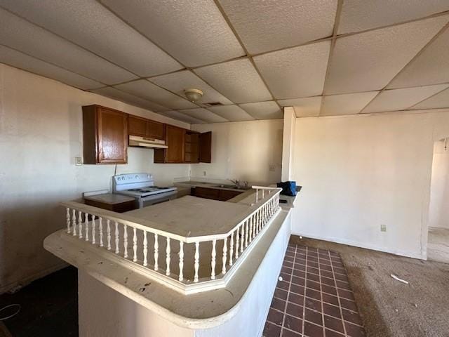 kitchen featuring a drop ceiling, sink, and white electric range