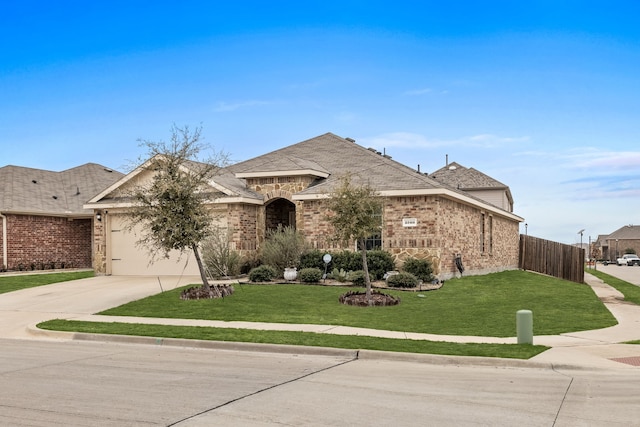 french country home featuring an attached garage, brick siding, fence, driveway, and a front lawn