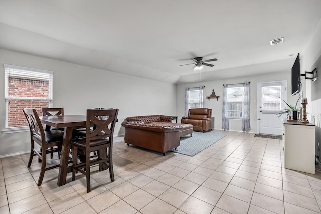 dining room with ceiling fan, visible vents, baseboards, and light tile patterned flooring