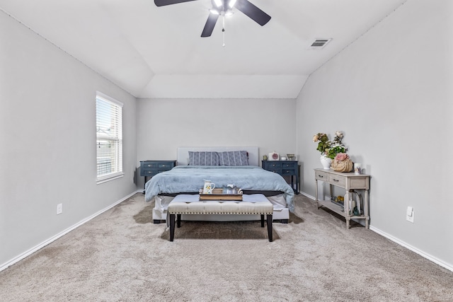 bedroom featuring ceiling fan, carpet flooring, and vaulted ceiling