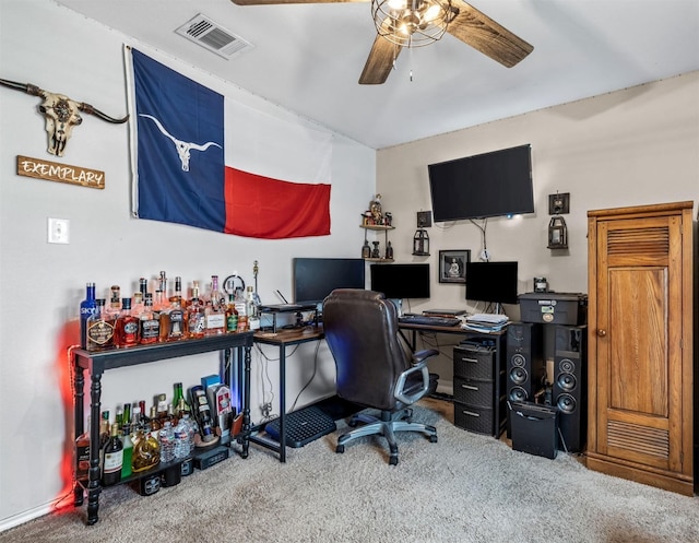 carpeted office space featuring a ceiling fan and visible vents