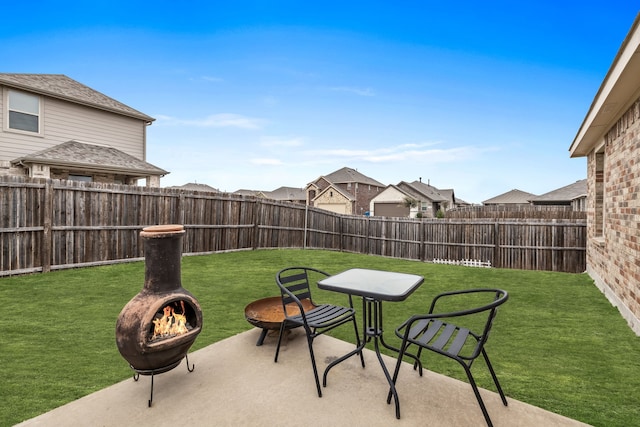 view of patio / terrace with an outdoor fire pit