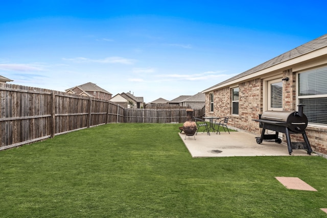 view of yard featuring a patio and a fenced backyard