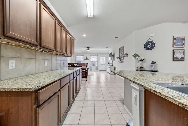 2260 Torch Lake Dr, Forney, TX 75126 - kitchen featuring open floor plan, recessed lighting, a ceiling fan, light stone countertops, and light tile patterned floors