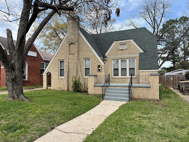 bungalow-style home with a front yard