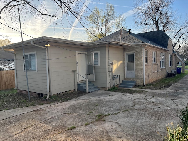 back of property with central AC unit