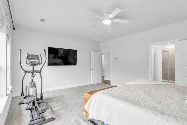 carpeted bedroom with ceiling fan and ensuite bath