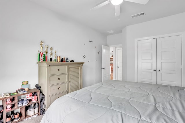 bedroom with ceiling fan and a closet