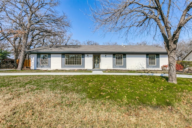 ranch-style home featuring a front yard