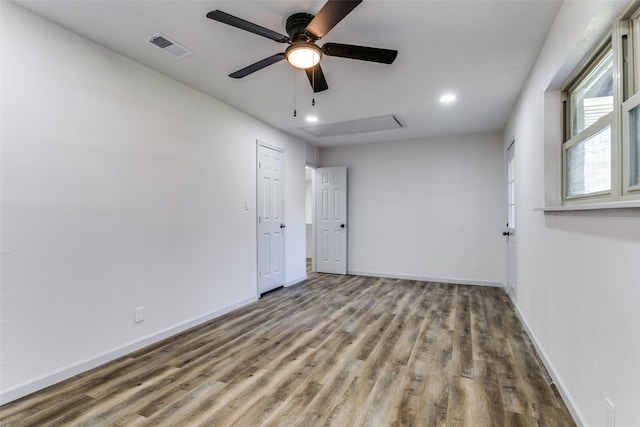 unfurnished room featuring hardwood / wood-style flooring and ceiling fan