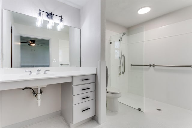 bathroom featuring a tile shower, sink, tile patterned flooring, and toilet