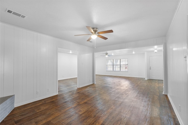 unfurnished room featuring ceiling fan and dark hardwood / wood-style floors