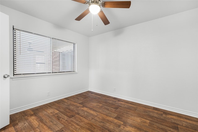 empty room with dark wood-type flooring and ceiling fan