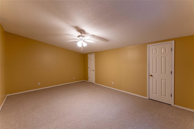 carpeted empty room with a textured ceiling and ceiling fan