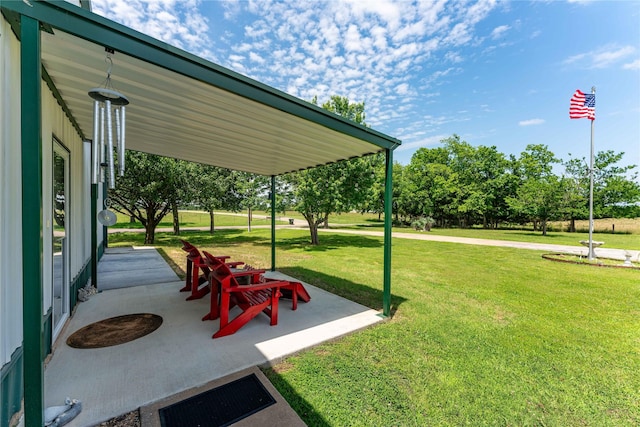 surrounding community with a yard and a patio