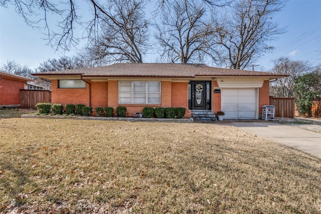 ranch-style house with a garage and a front yard