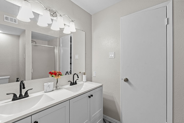 bathroom with vanity and walk in shower