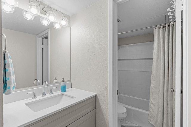 full bathroom with toilet, vanity, shower / tub combo, and a textured ceiling