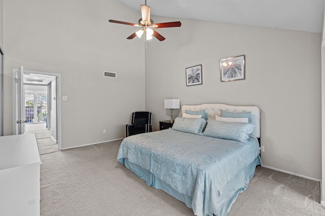 bedroom with ceiling fan, high vaulted ceiling, and carpet floors