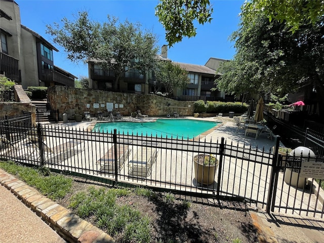 view of pool featuring a patio