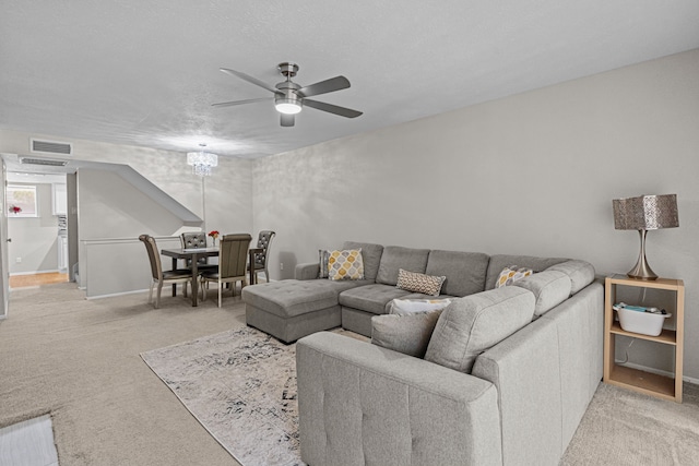 living room featuring light carpet and ceiling fan