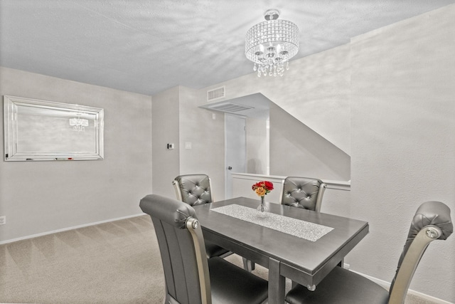 dining area featuring a notable chandelier and carpet