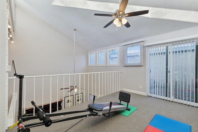 workout room with vaulted ceiling, carpet, and ceiling fan