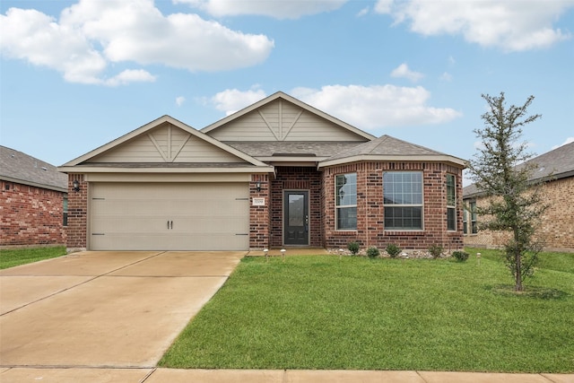 view of front facade with a garage and a front yard