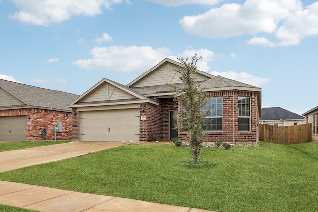 view of front of home featuring a garage and a front yard